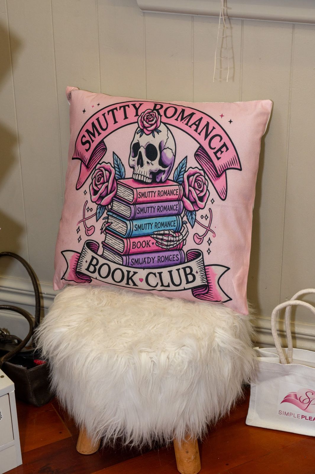 A book club cushion on a stall