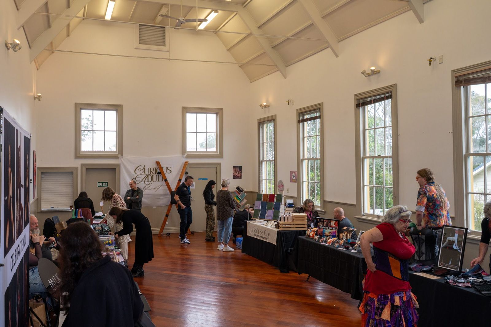 Guests browsing stalls in the market hall