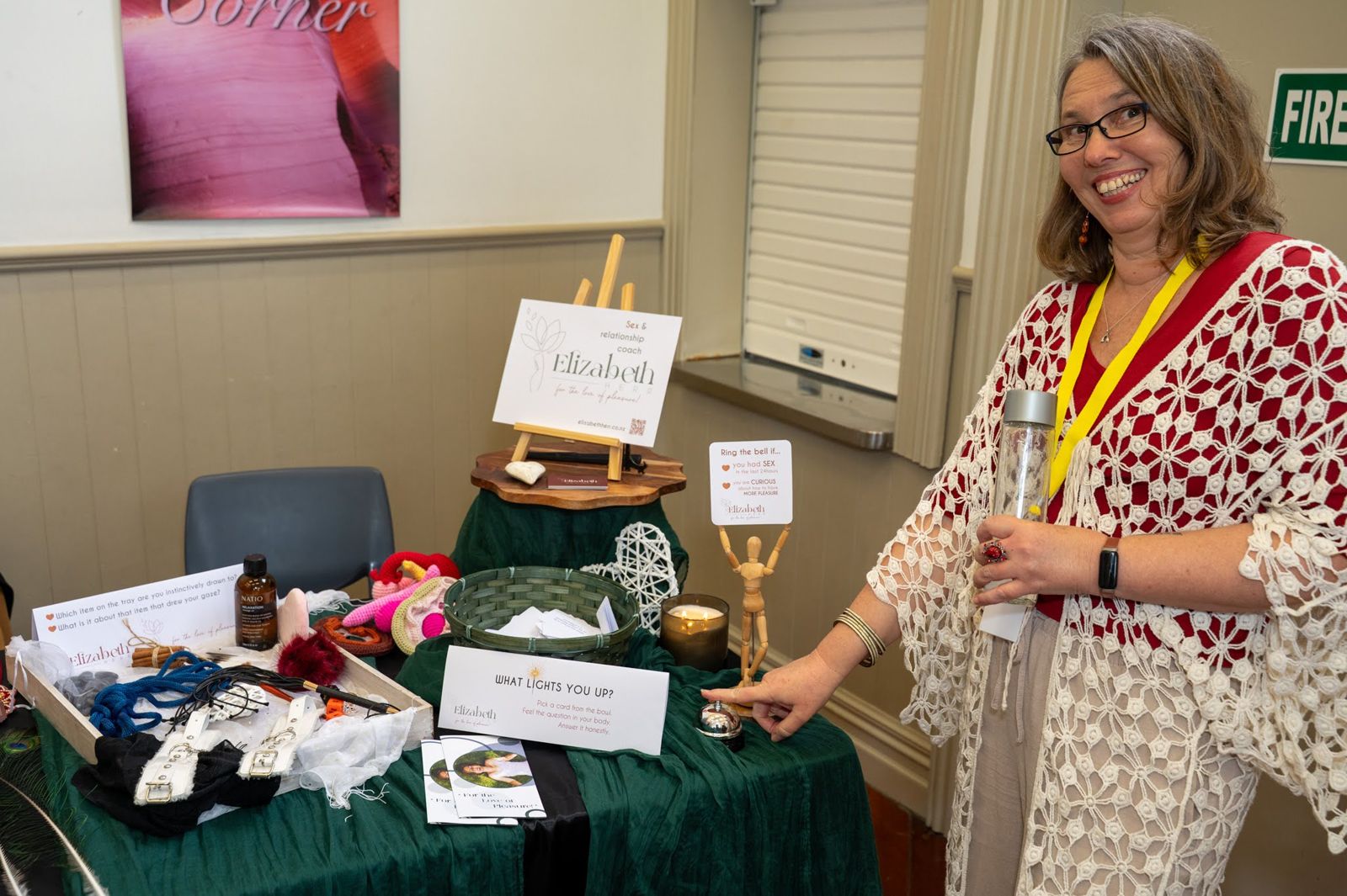 An educator chatting with visitors at their stall