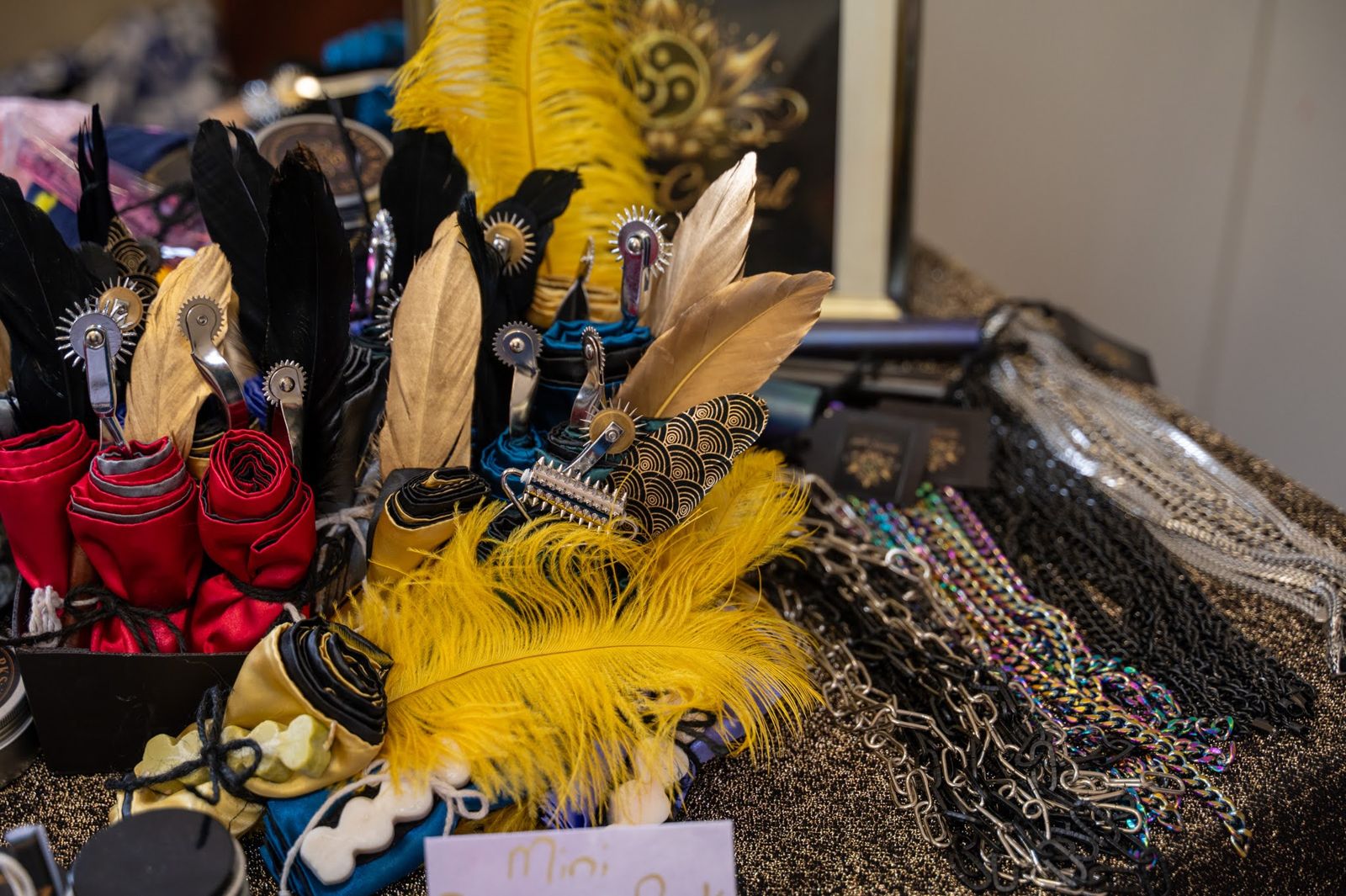 Close-up of gold feathers on a stall display